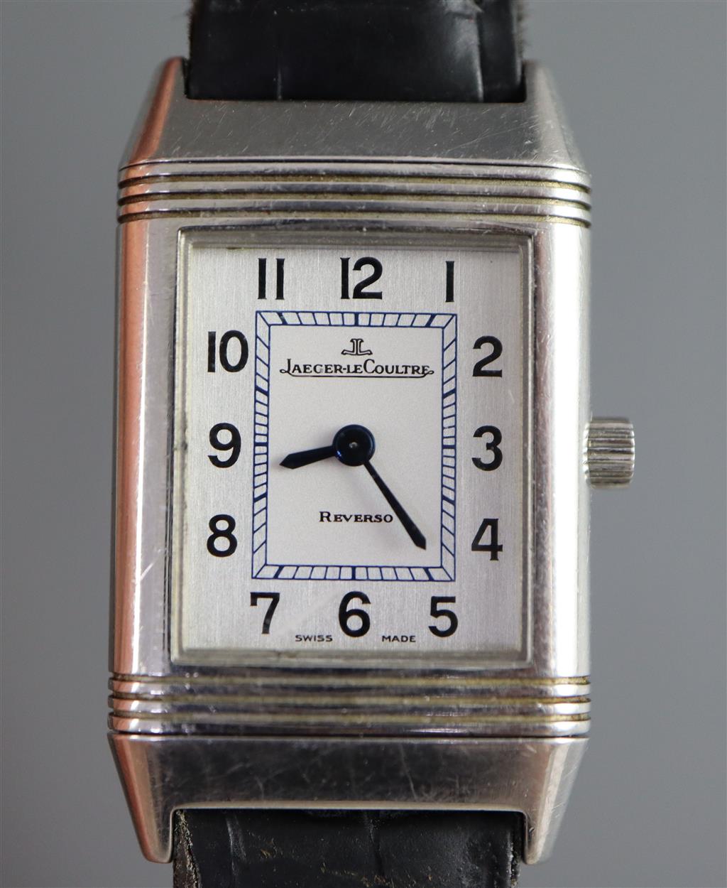 A ladys stainless steel Jaeger LeCoultre Reverso quartz wrist watch, on leather strap with Jaeger LeCoultre buckle,